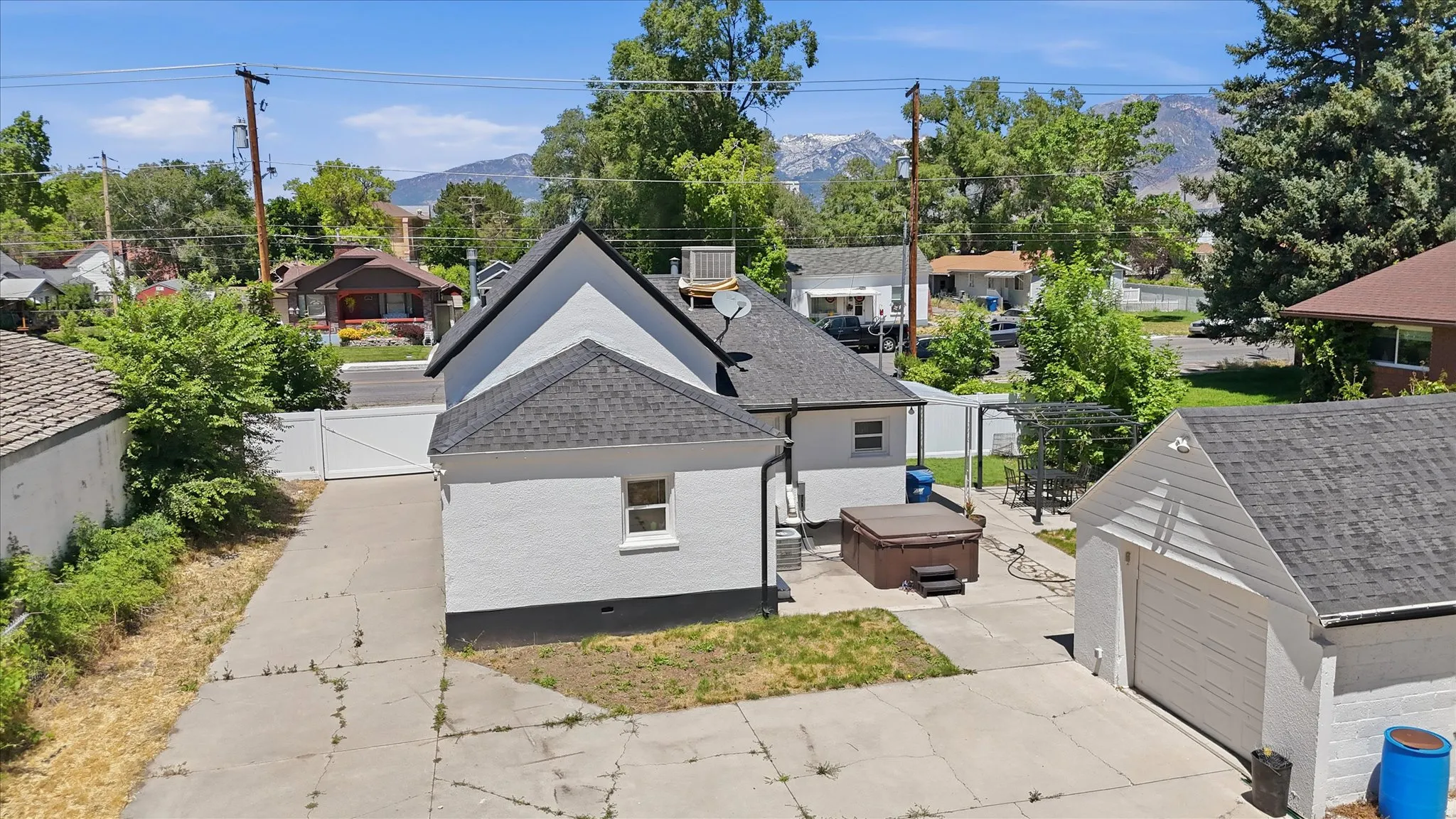 White exterior with black shingle roofing