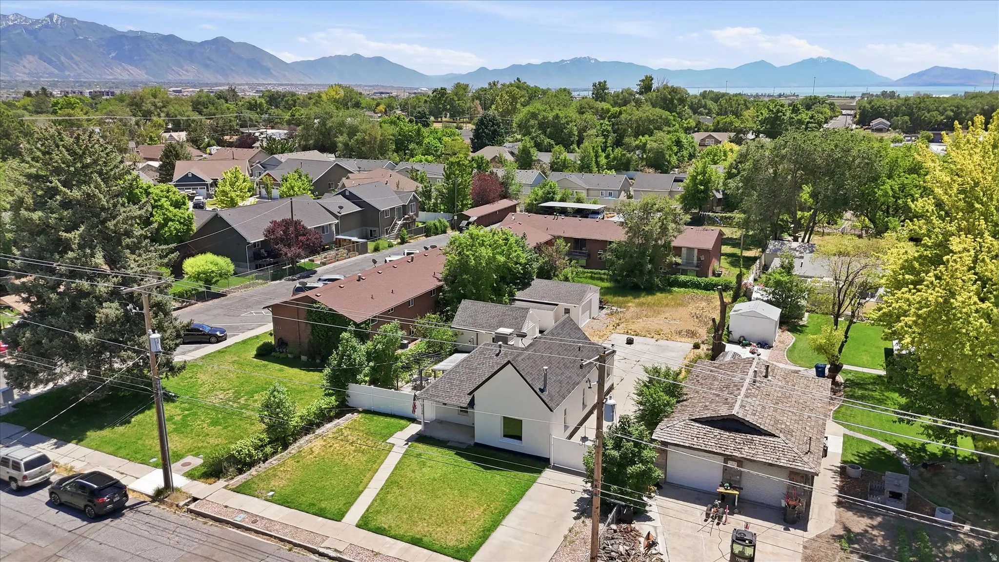 Aerial perspective showcasing a residential neighborhood with verdant landscaping and established homes