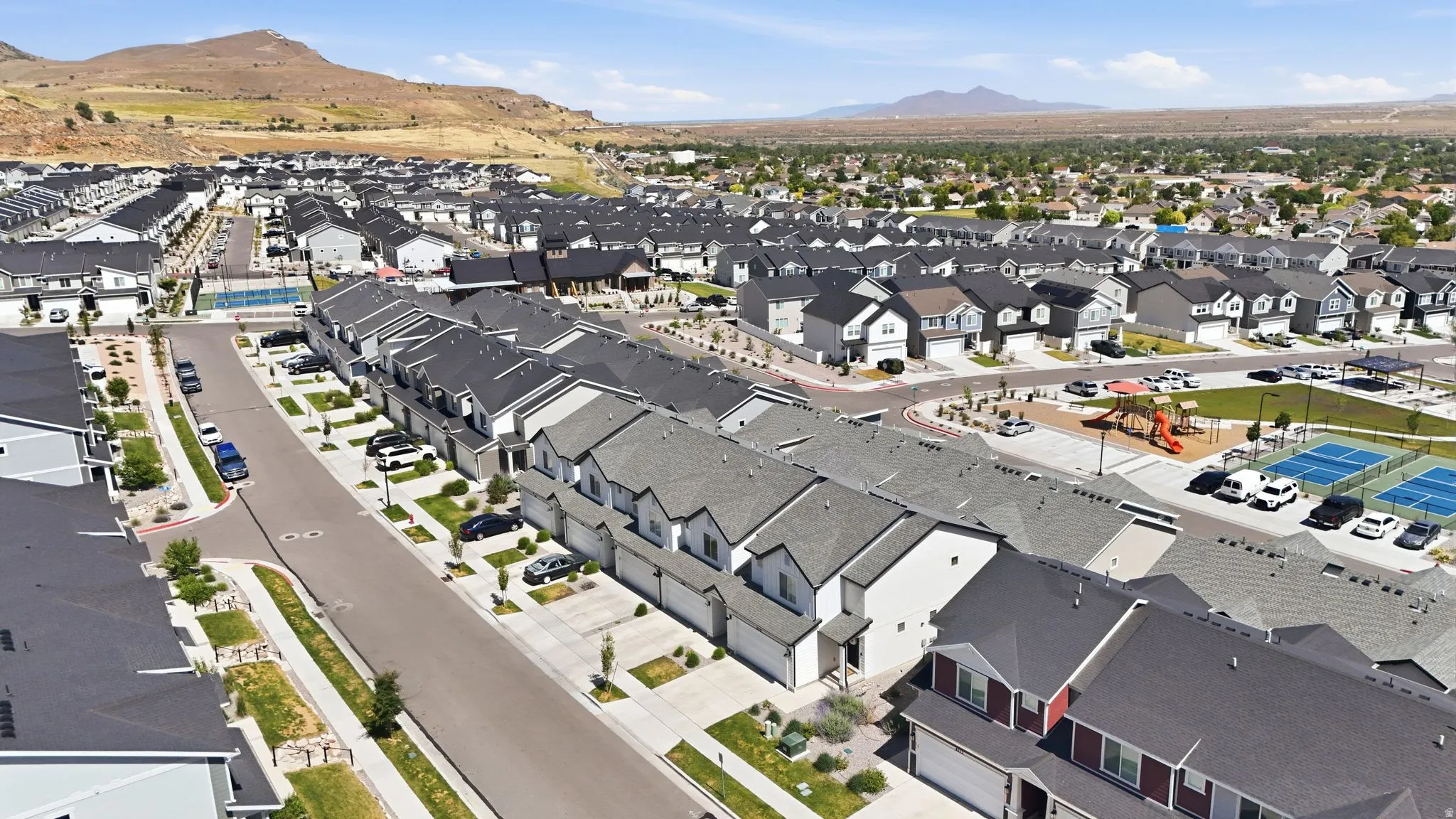 Expansive residential development featuring modern townhomes and single-family residences