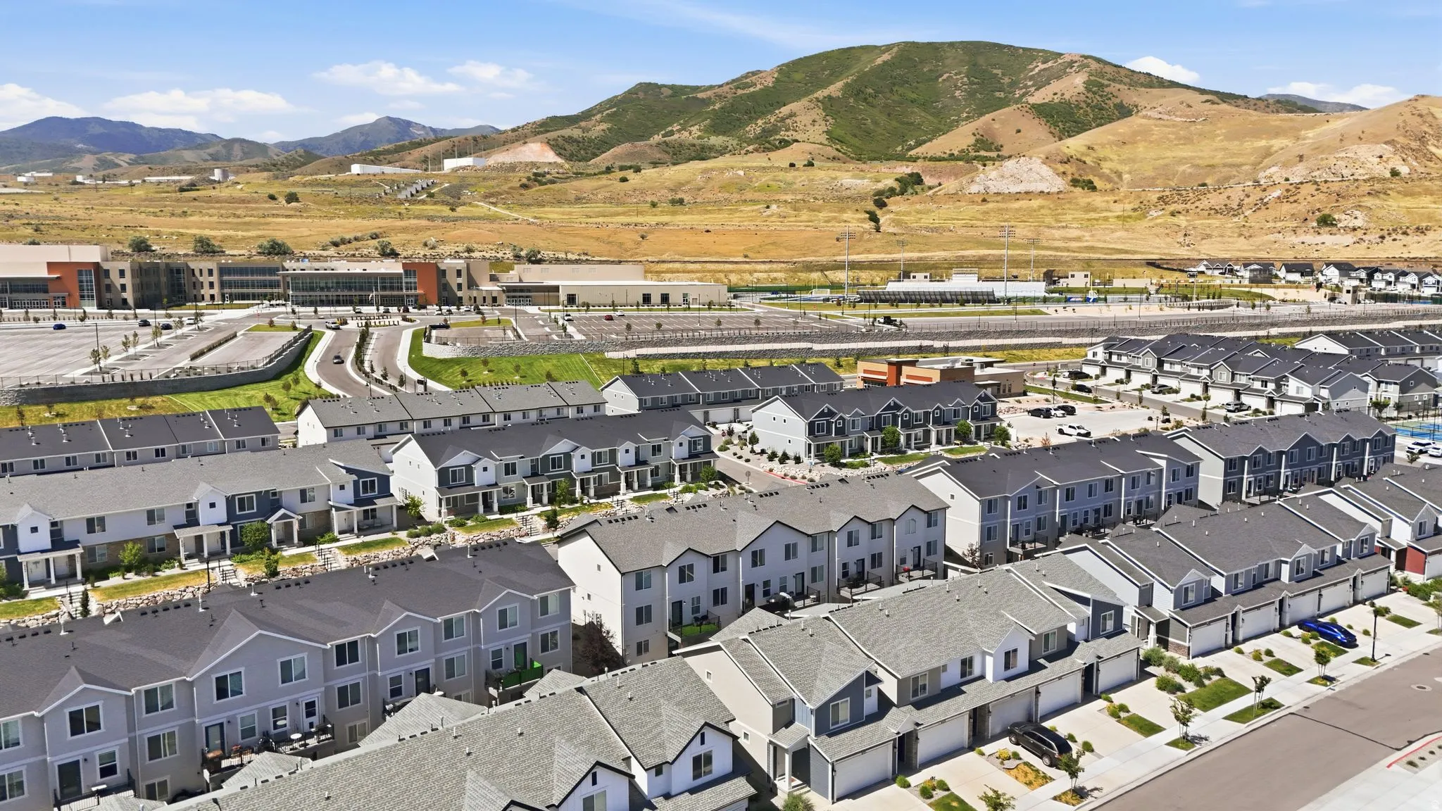 Contemporary townhome community with varied architectural facades and attached garages