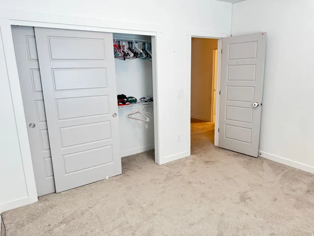 Neutral-toned carpeting and white walls