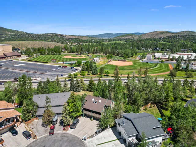 Aerial perspective showcasing proximity to multi-field sports complex and expansive paved parking