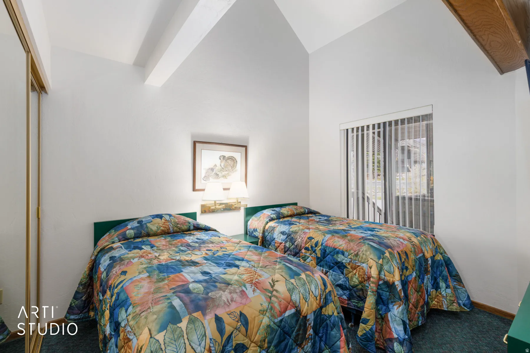 Room featuring vaulted ceilings with exposed wood beams, a wall-mounted light fixture, sliding glass doors with vertical blinds, and a mirrored closet
