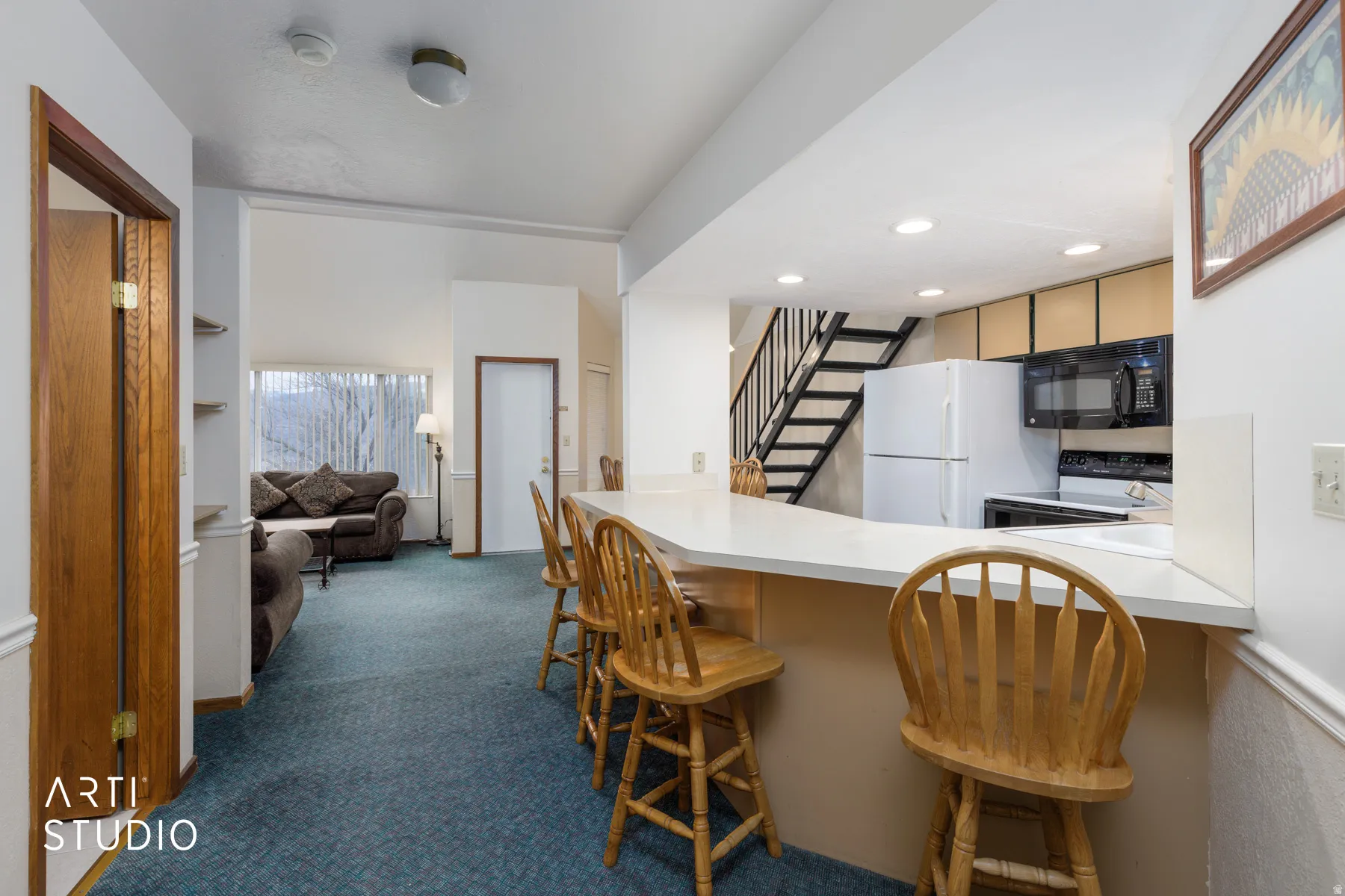 Kitchen pass-through featuring an extended countertop, providing ample surface area