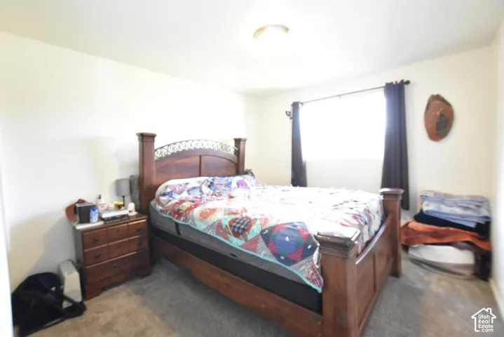 Bedroom featuring neutral wall colors and carpet flooring