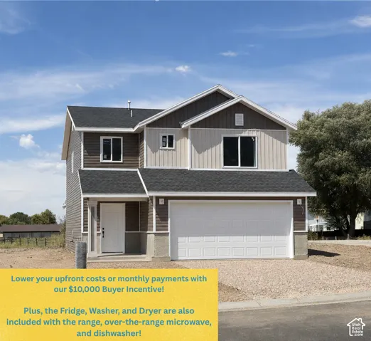 Two-story exterior with multi-toned siding, attached garage, and prominent front entry
