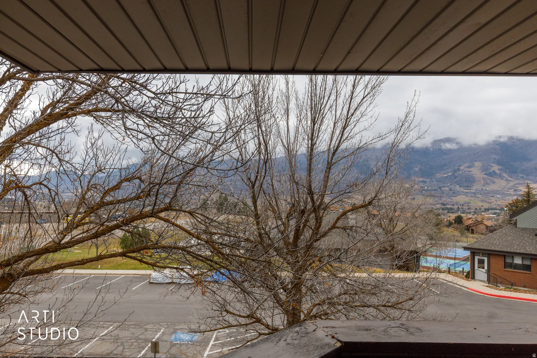 Mountain and valley scenery from a balcony with a ribbed soffit