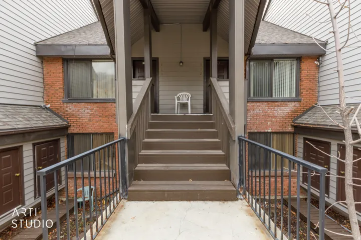 Multi-level exterior featuring brick and siding accents