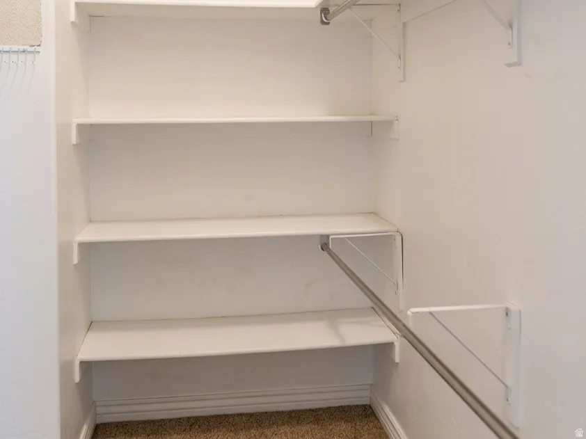 White-painted shelving units providing storage