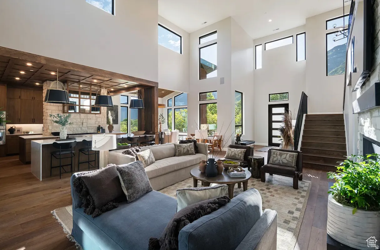 Expansive living area with soaring ceilings and abundant natural light