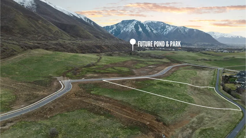 Expansive land parcel featuring established roadways and mountainous terrain