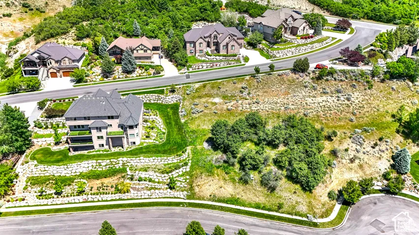 Terraced hillside property with extensive retaining walls and manicured lawn areas