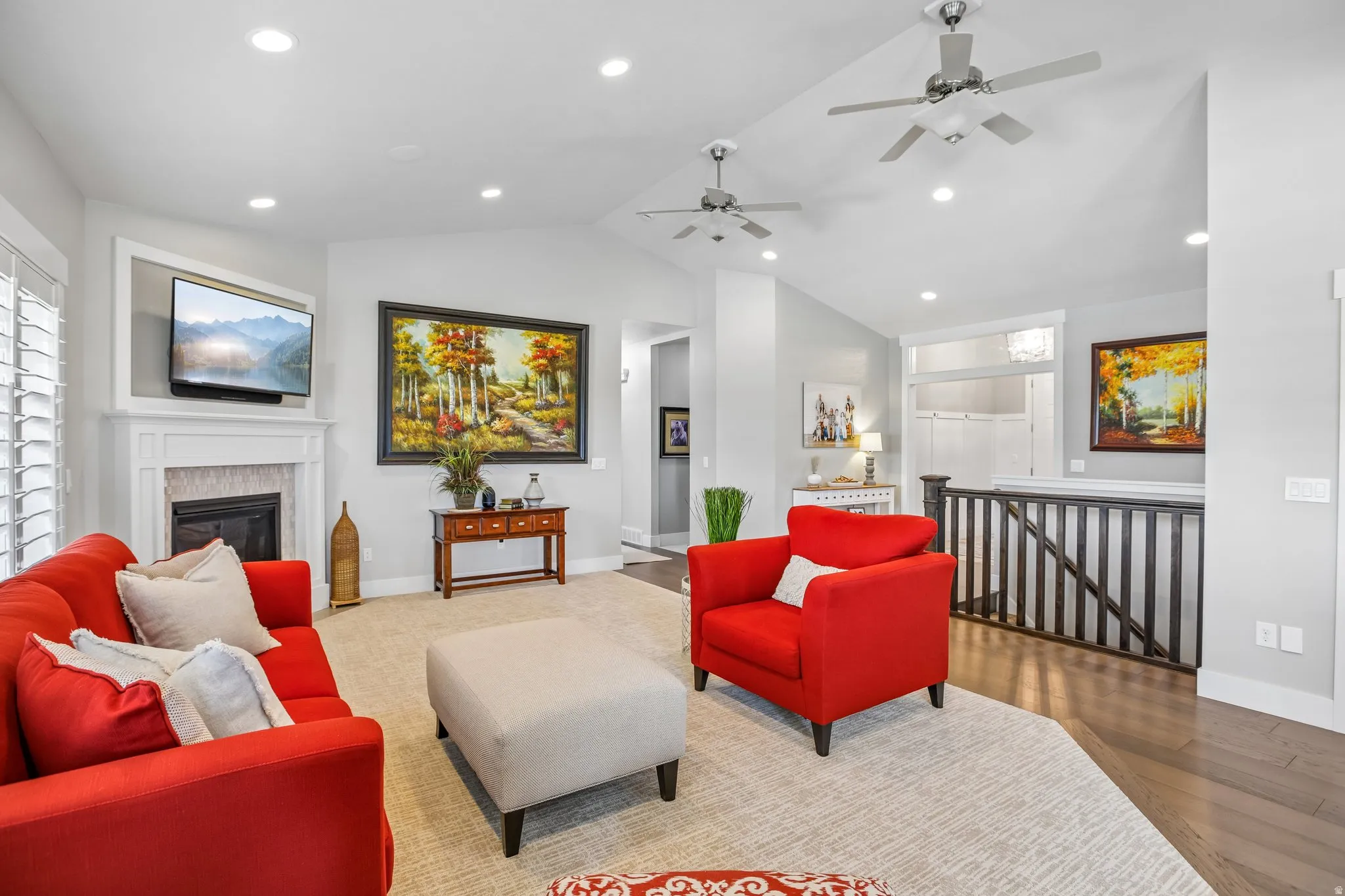 Vaulted ceilings with recessed lighting and ceiling fans