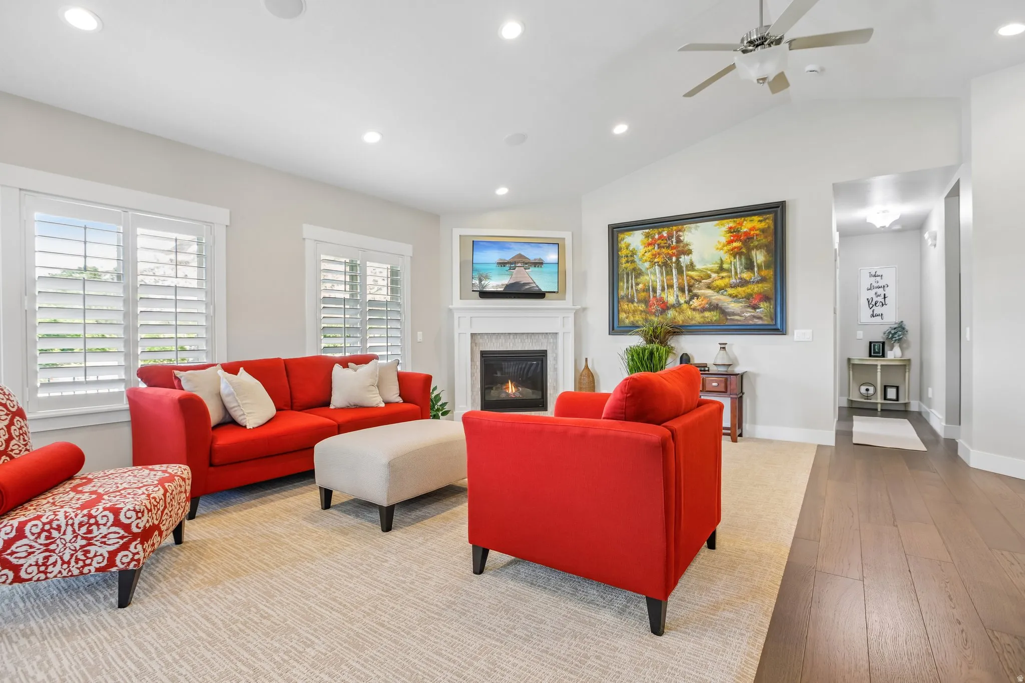 Living room with gas fireplace, plantation shutters and new carpet and paint