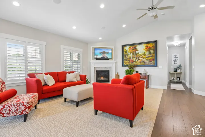 Living room with gas fireplace, plantation shutters and new carpet and paint