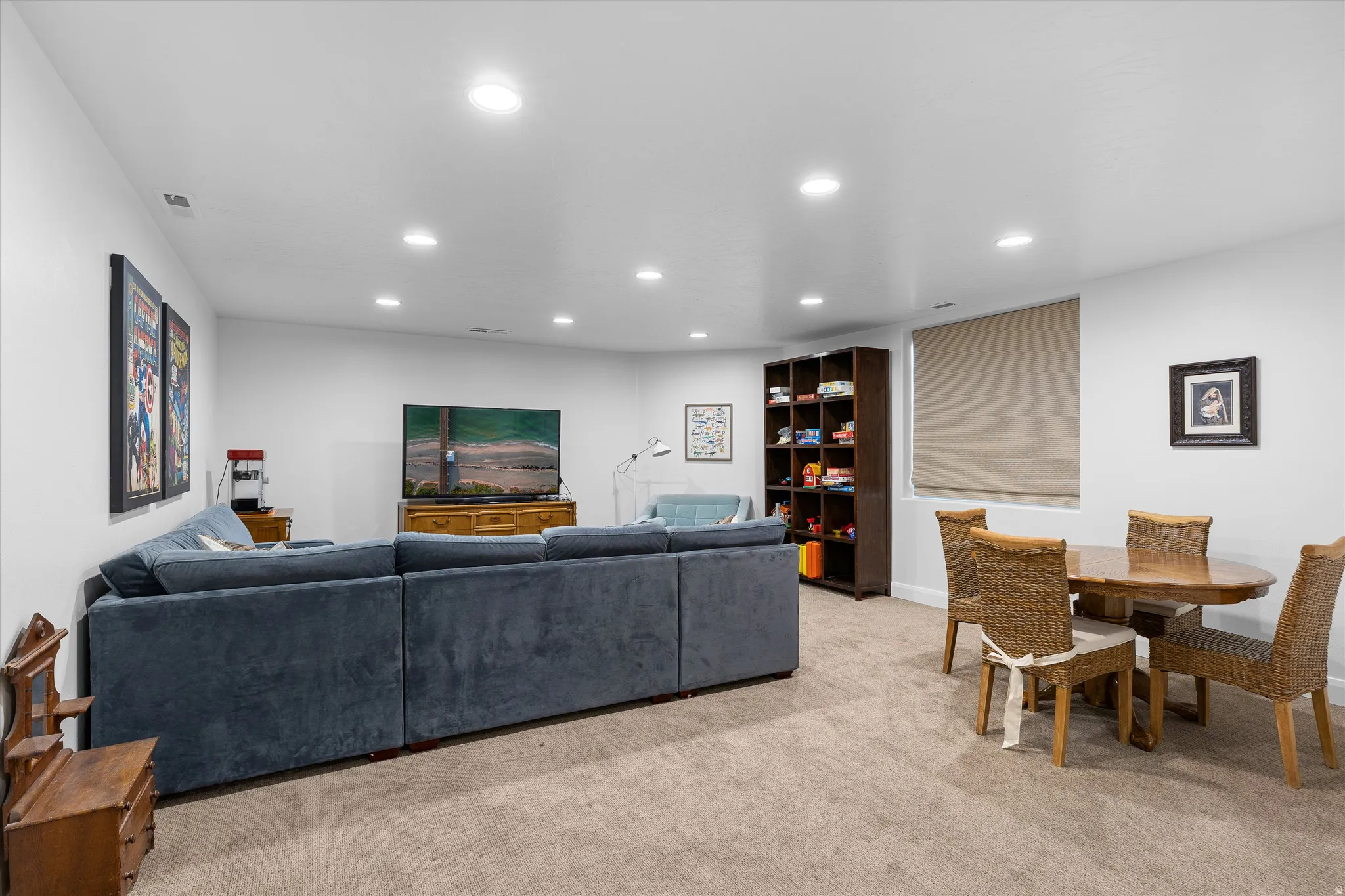 Spacious room featuring neutral carpeting and recessed lighting