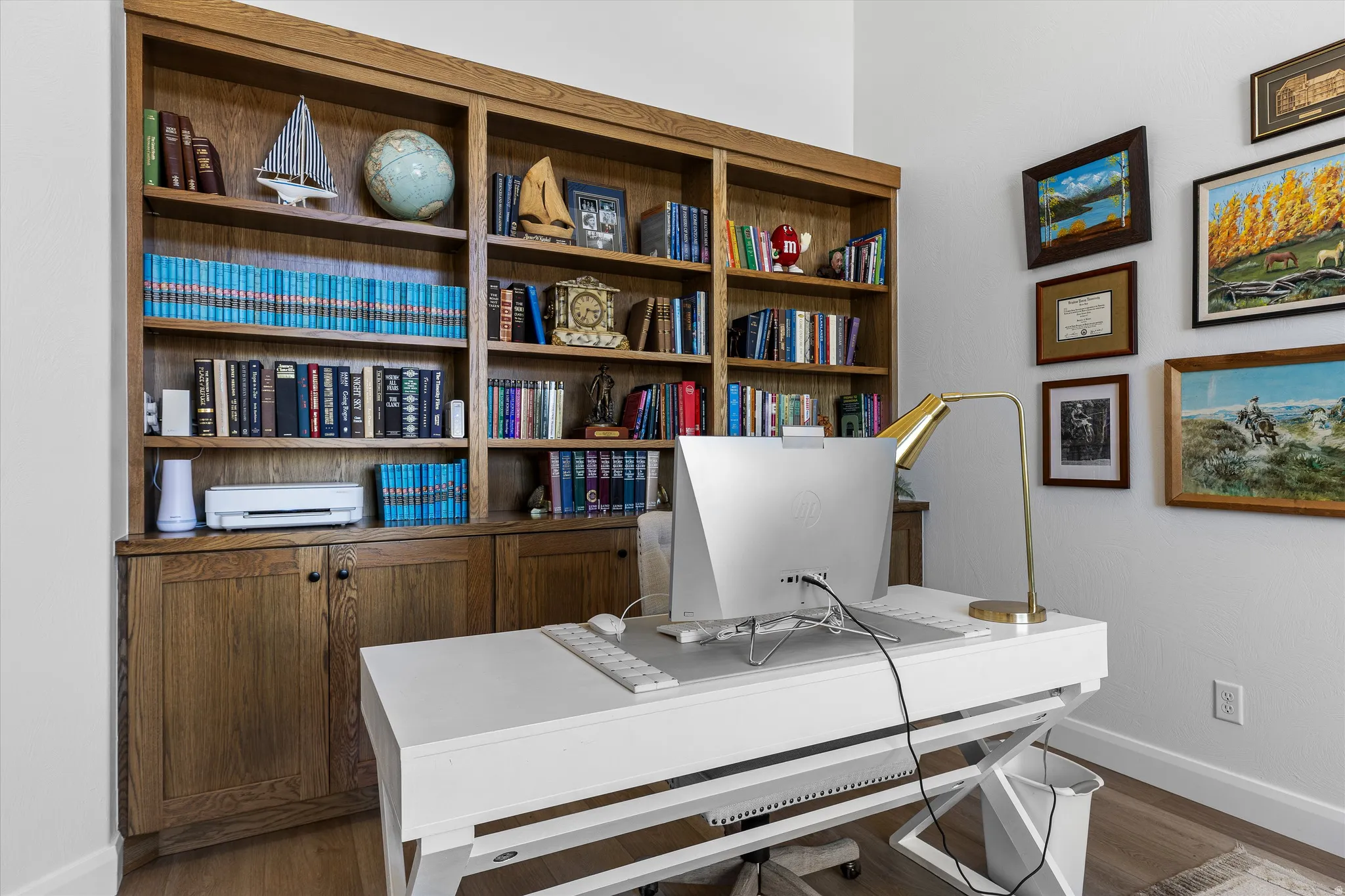 Custom built-in wood cabinetry and shelving provide extensive storage and display options