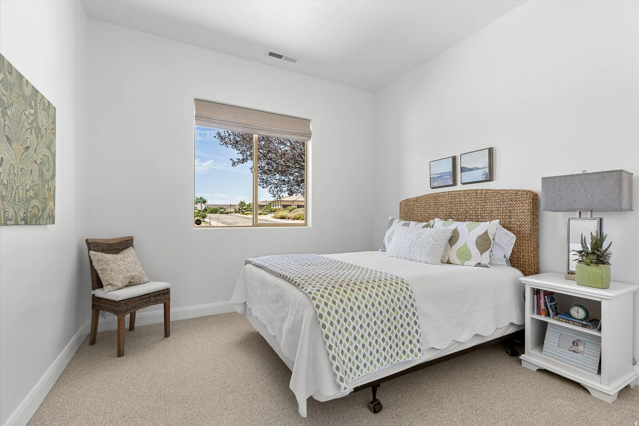 Bedroom featuring neutral carpeting and white walls
