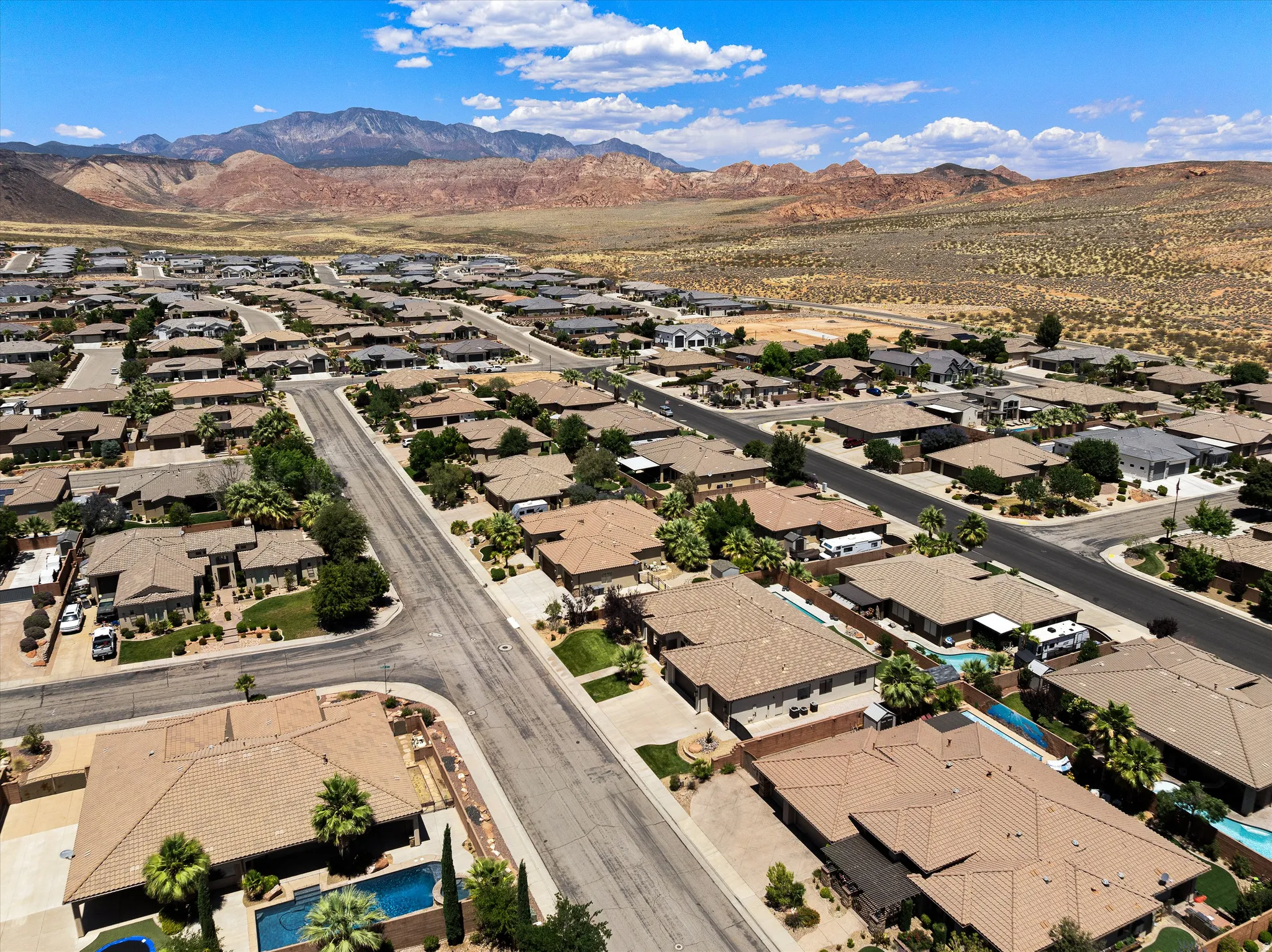 Expansive residential community featuring single-story homes, mature landscaping, and private swimming pools