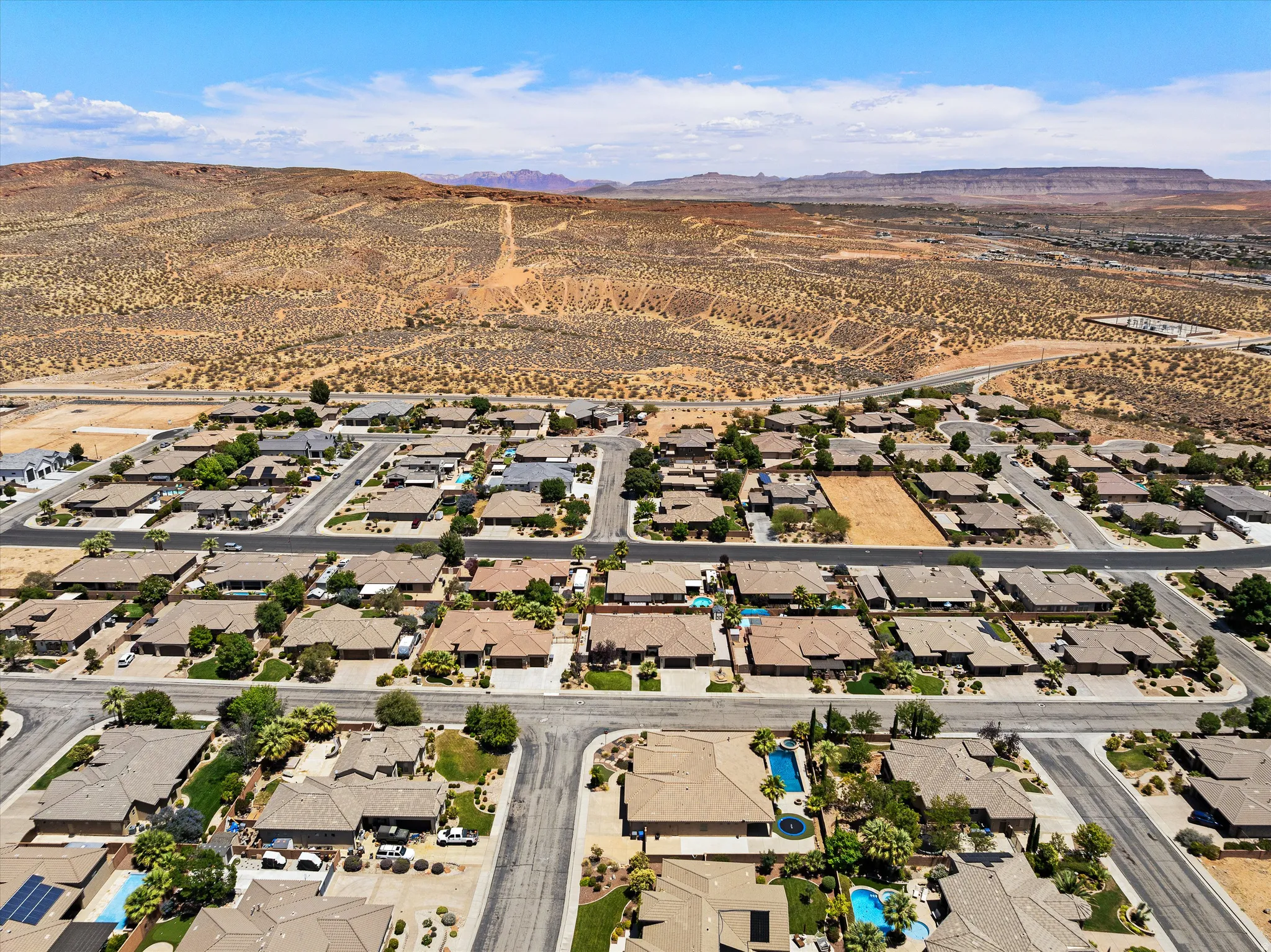 Aerial perspective showcasing a residential community with paved streets and individual properties