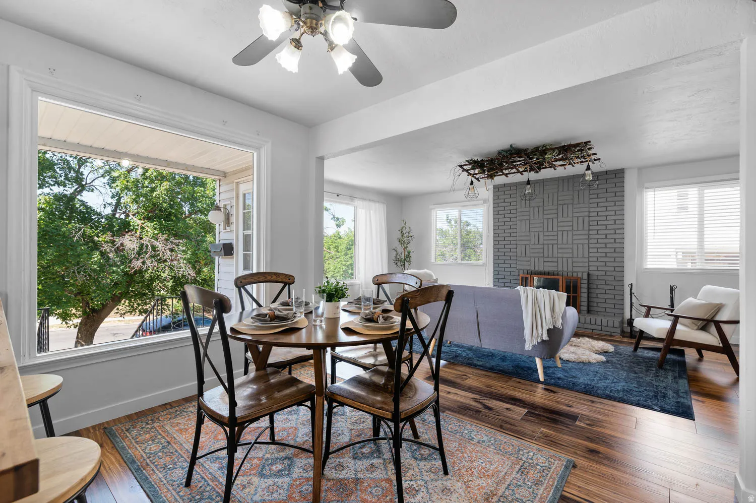Dining area featuring a prominent bay window and wood-finish flooring