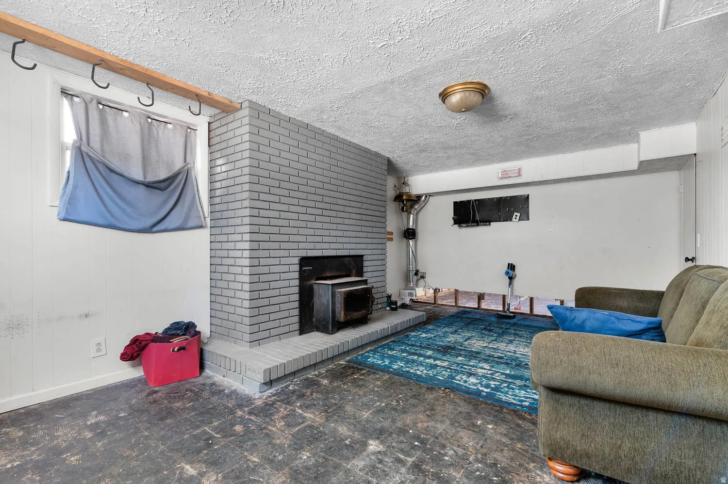 Brick fireplace with a wood-burning insert