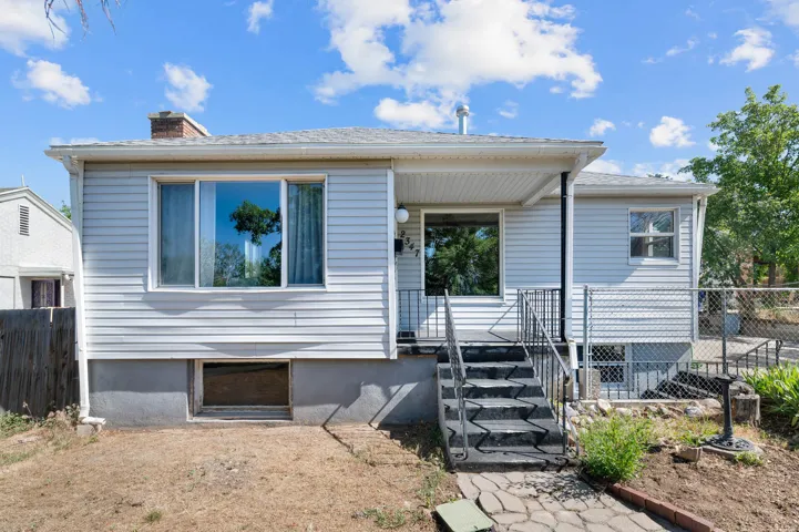 Light blue siding exterior featuring a covered porch entrance