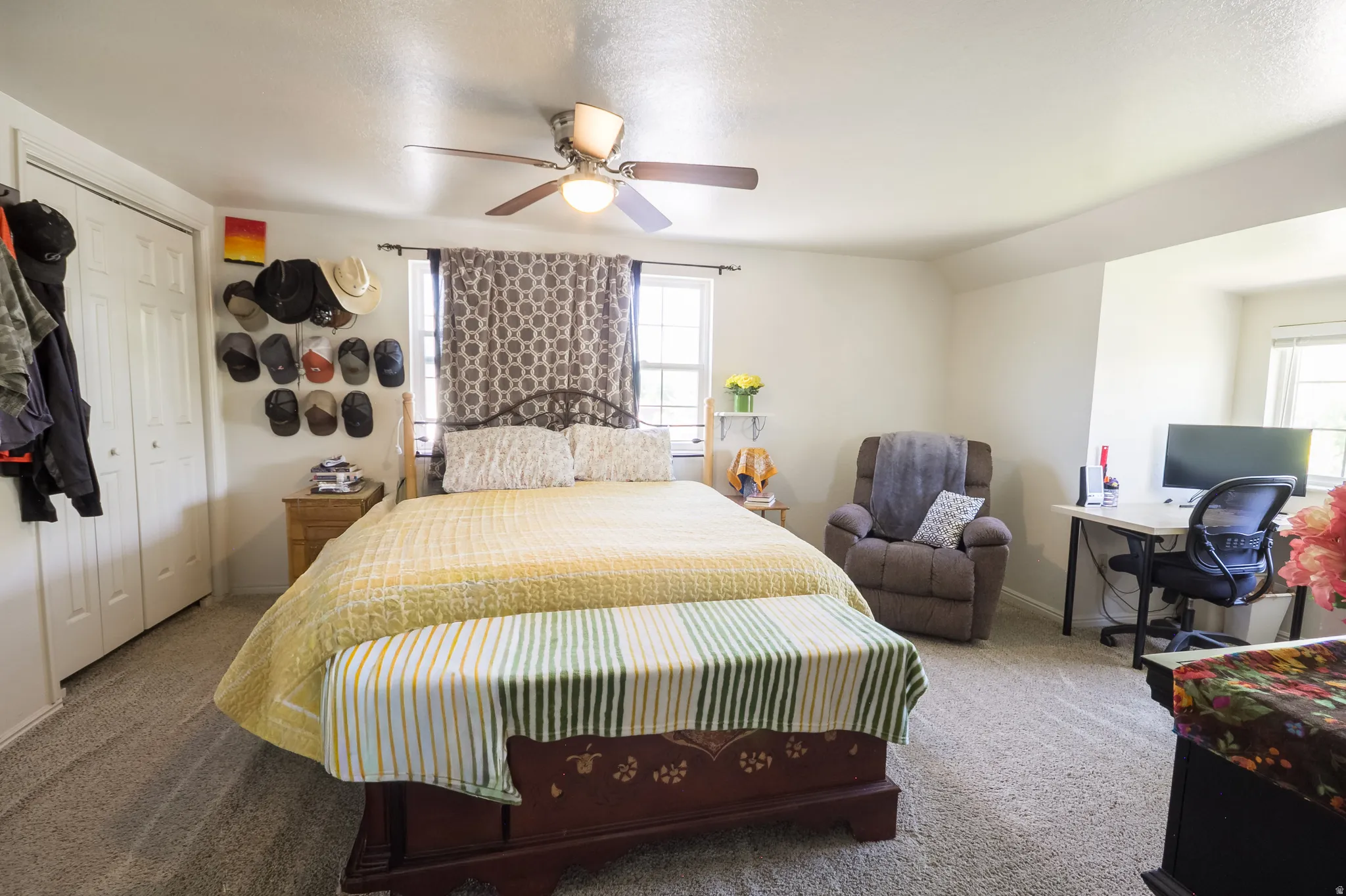 Spacious room featuring neutral carpeting and white walls