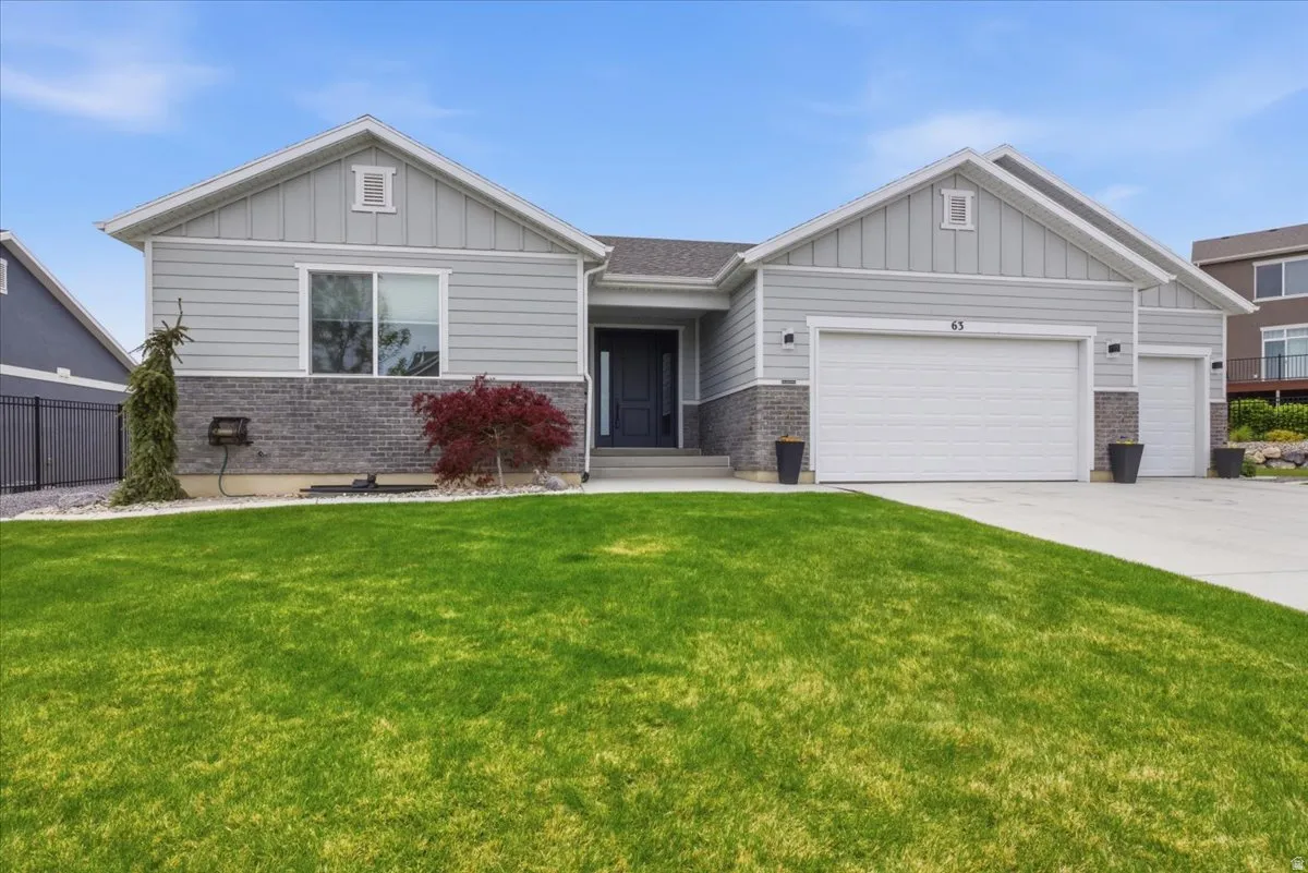 Light gray siding exterior with dark gray brick accents