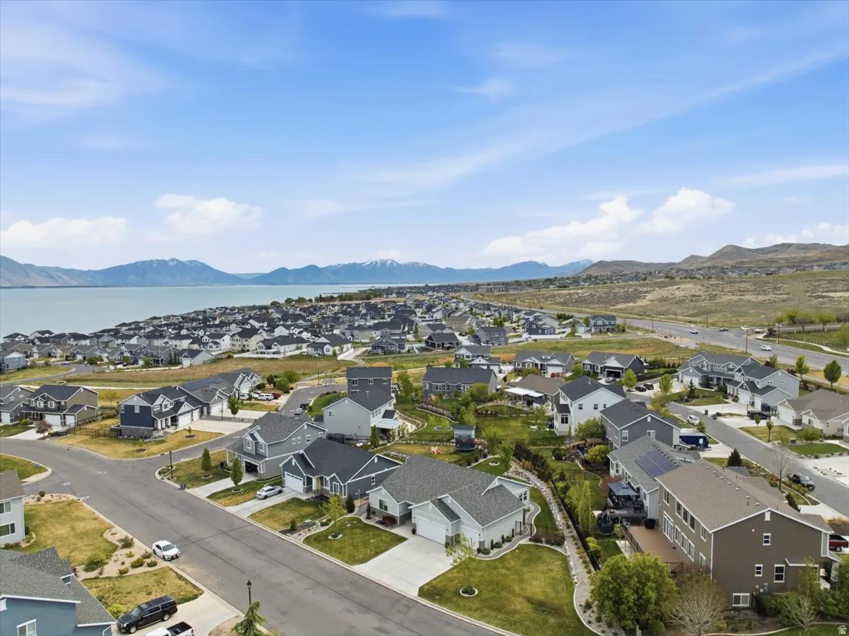 Residential community featuring a variety of single-family homes with gray and white exteriors
