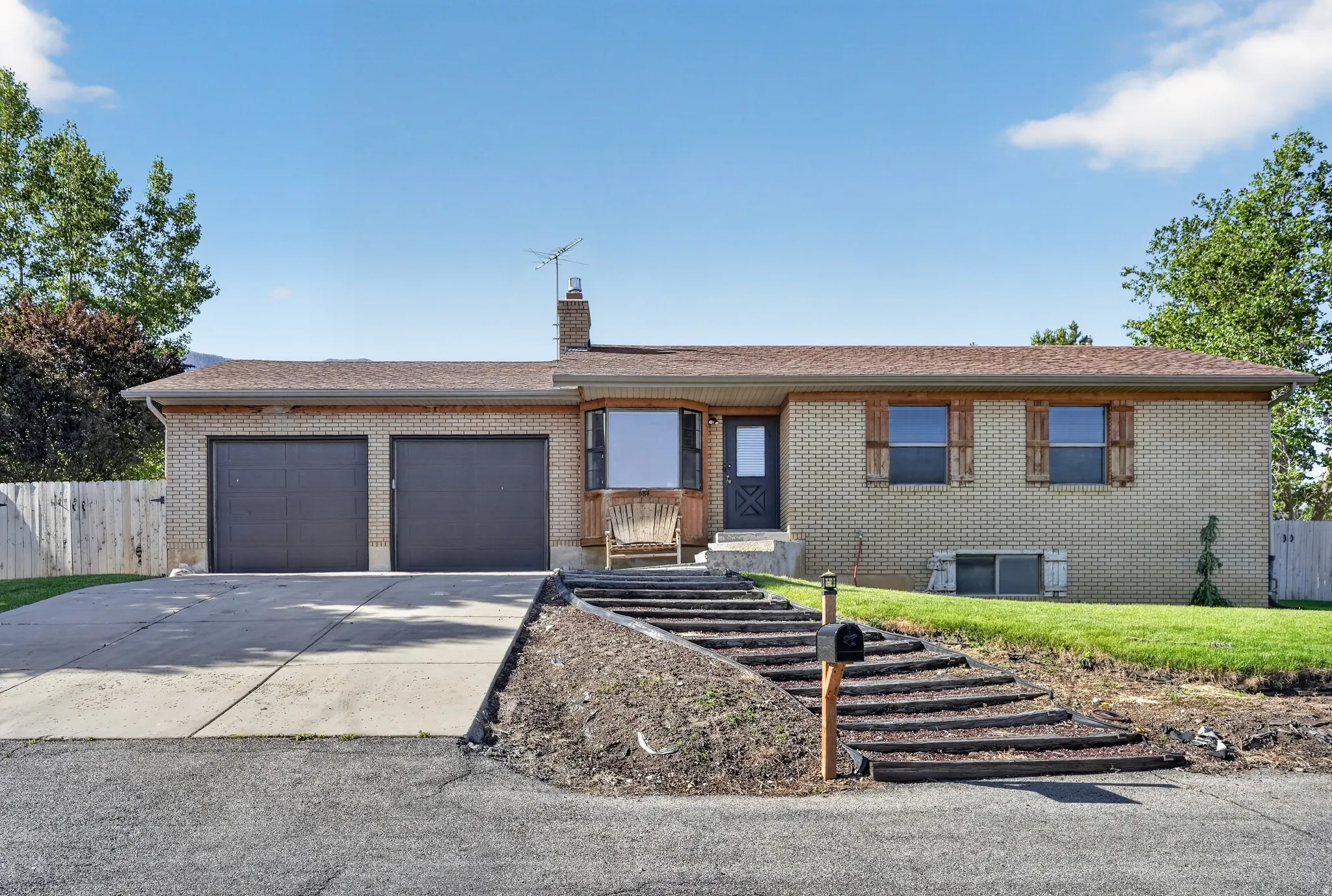 Brick exterior with a two-car garage