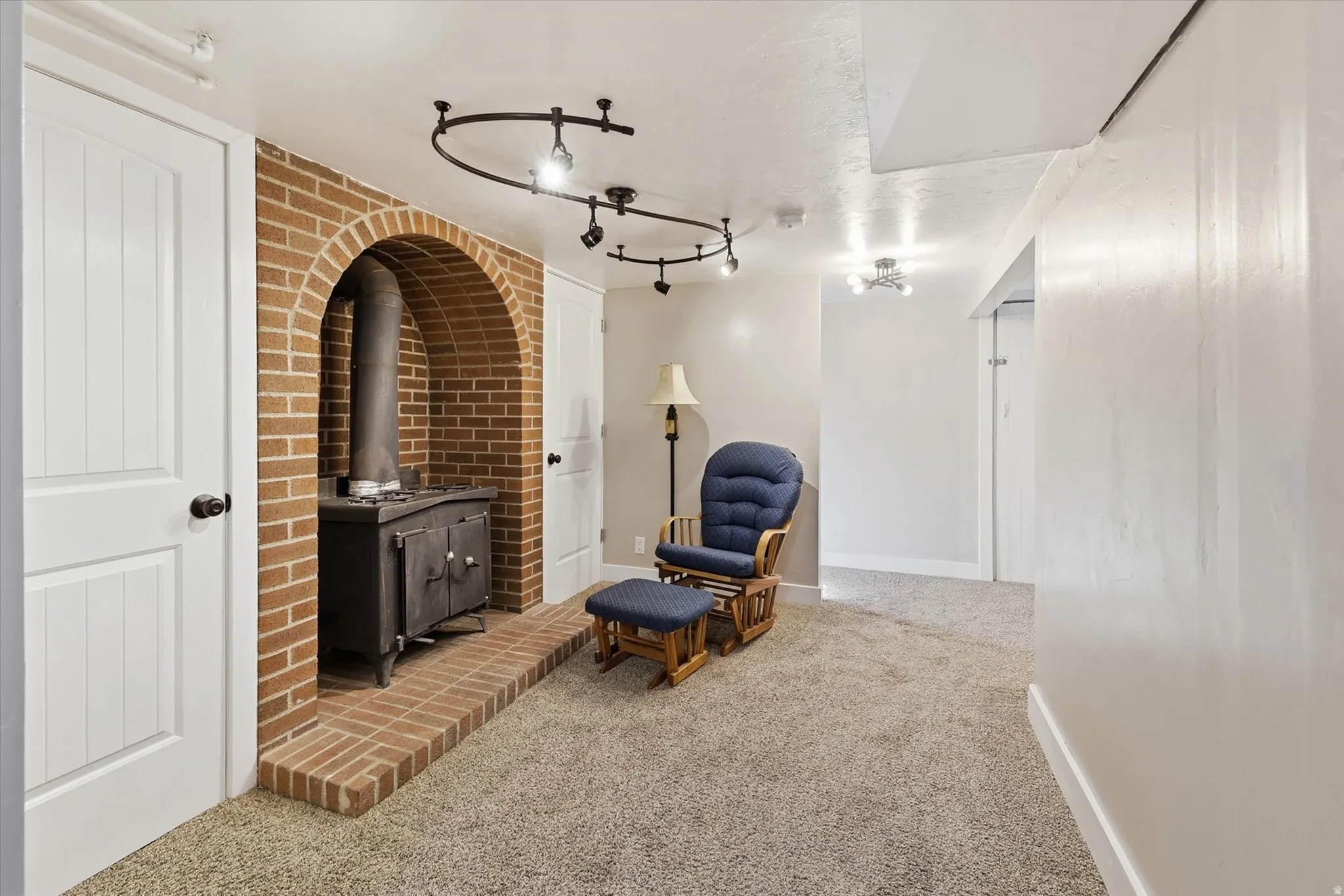 Brick archway featuring a wood-burning stove