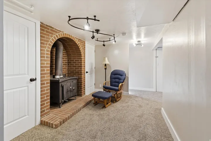 Brick archway featuring a wood-burning stove
