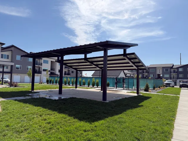 Outdoor covered patio structure with a concrete pad