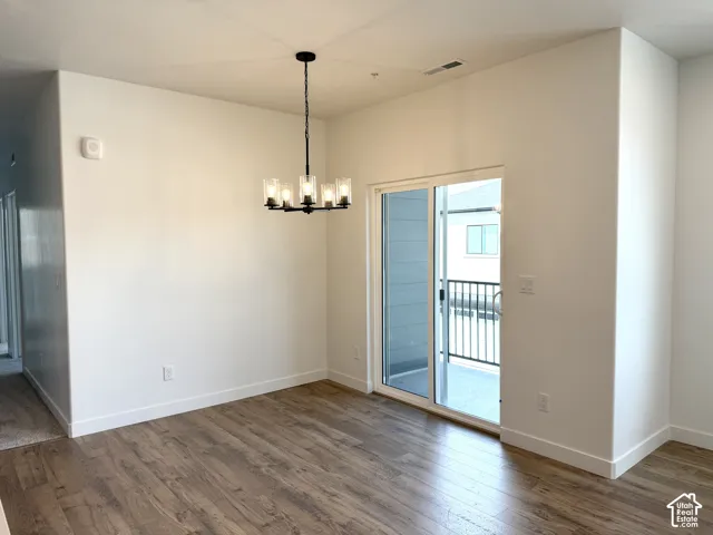 Wood-finish flooring throughout, complemented by white baseboards