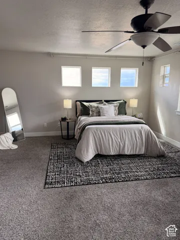 Three square windows, an additional rectangular window, and a ceiling fan with integrated lighting