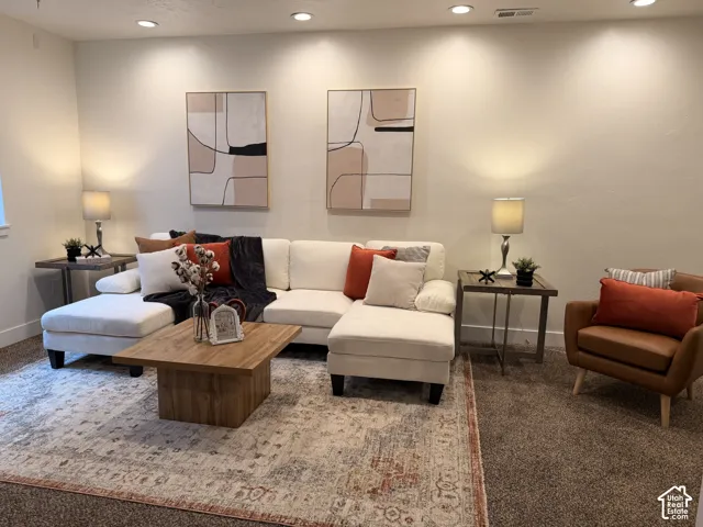 Recessed ceiling lighting, light-toned wall finishes, and a window providing natural light