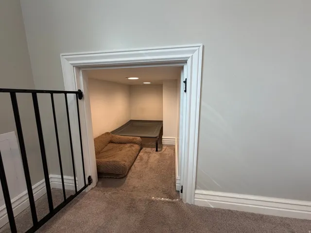 Carpeted niche with recessed lighting, crown molding, and baseboard trim