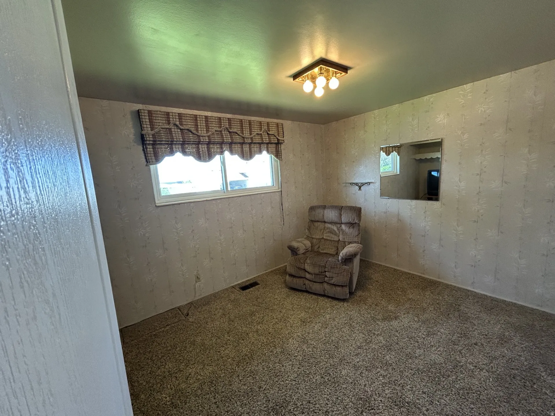 3rd Bedroom, Television Room or Office with carpeting, patterned wallpaper, and a window with a valance
