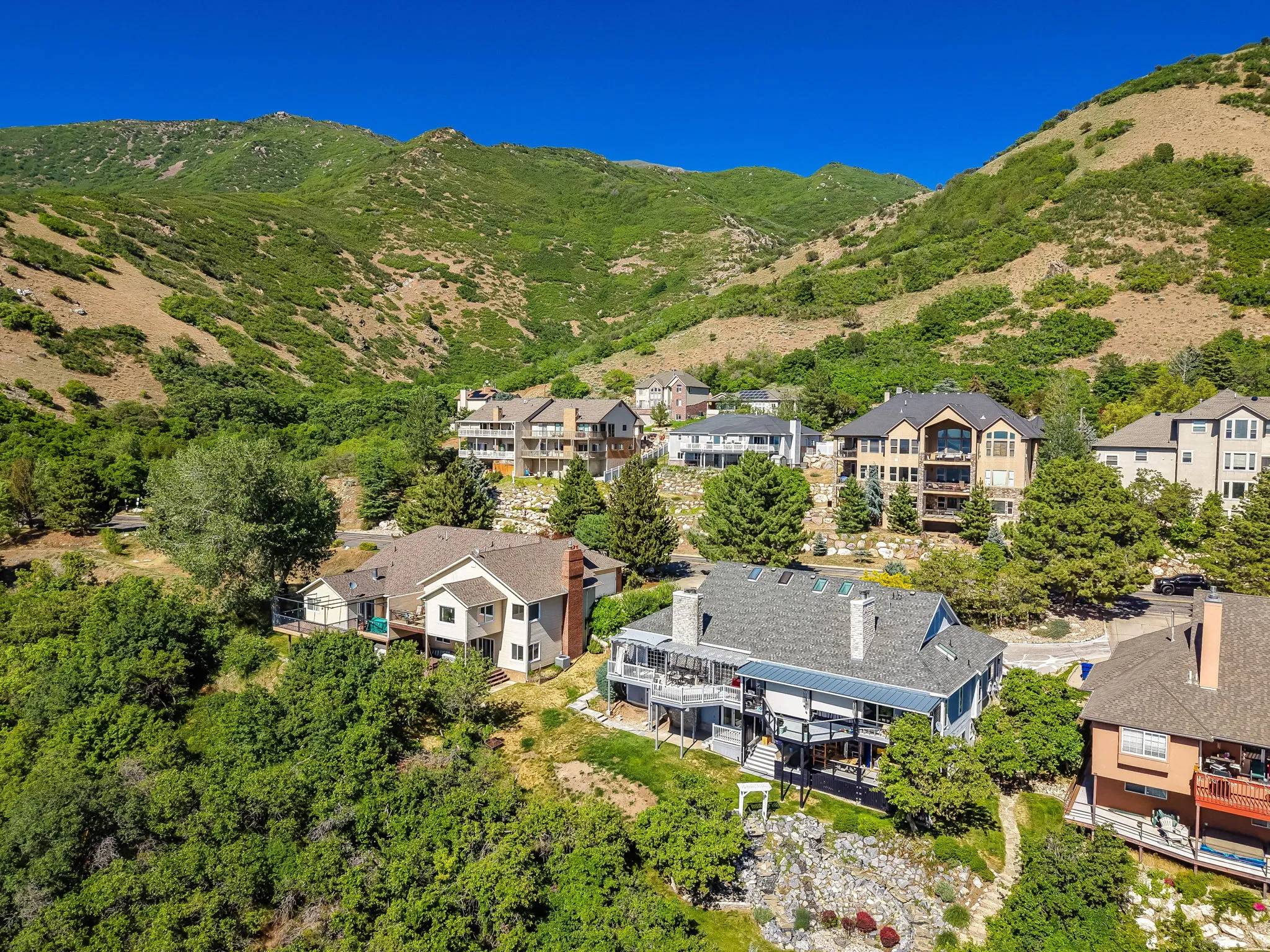 Mountainous terrain surrounding a community of residential properties