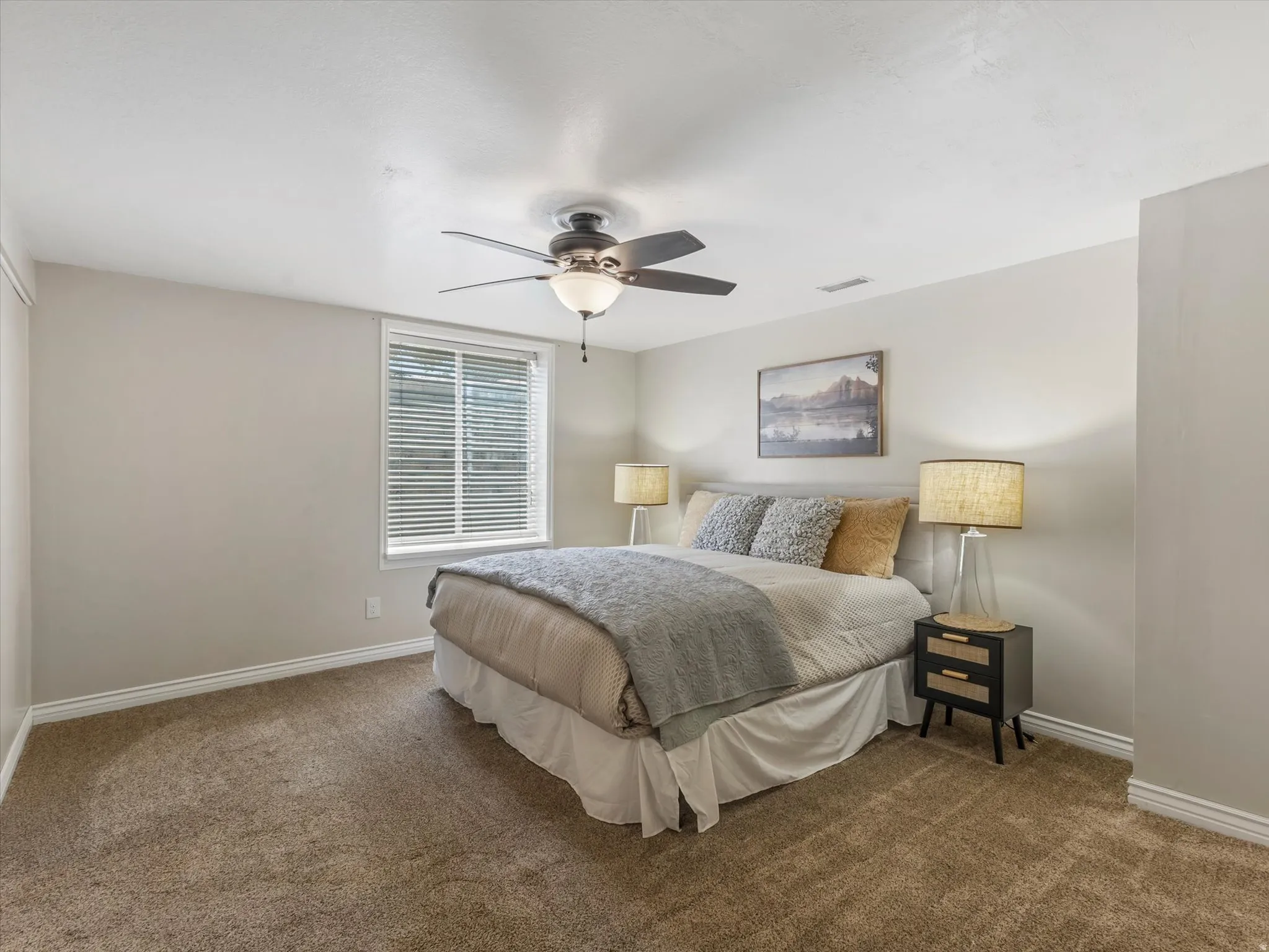 PRIMARY Bedroom featuring neutral wall tones, window with horizontal blinds, ceiling fan with integrated lighting, and carpet flooring