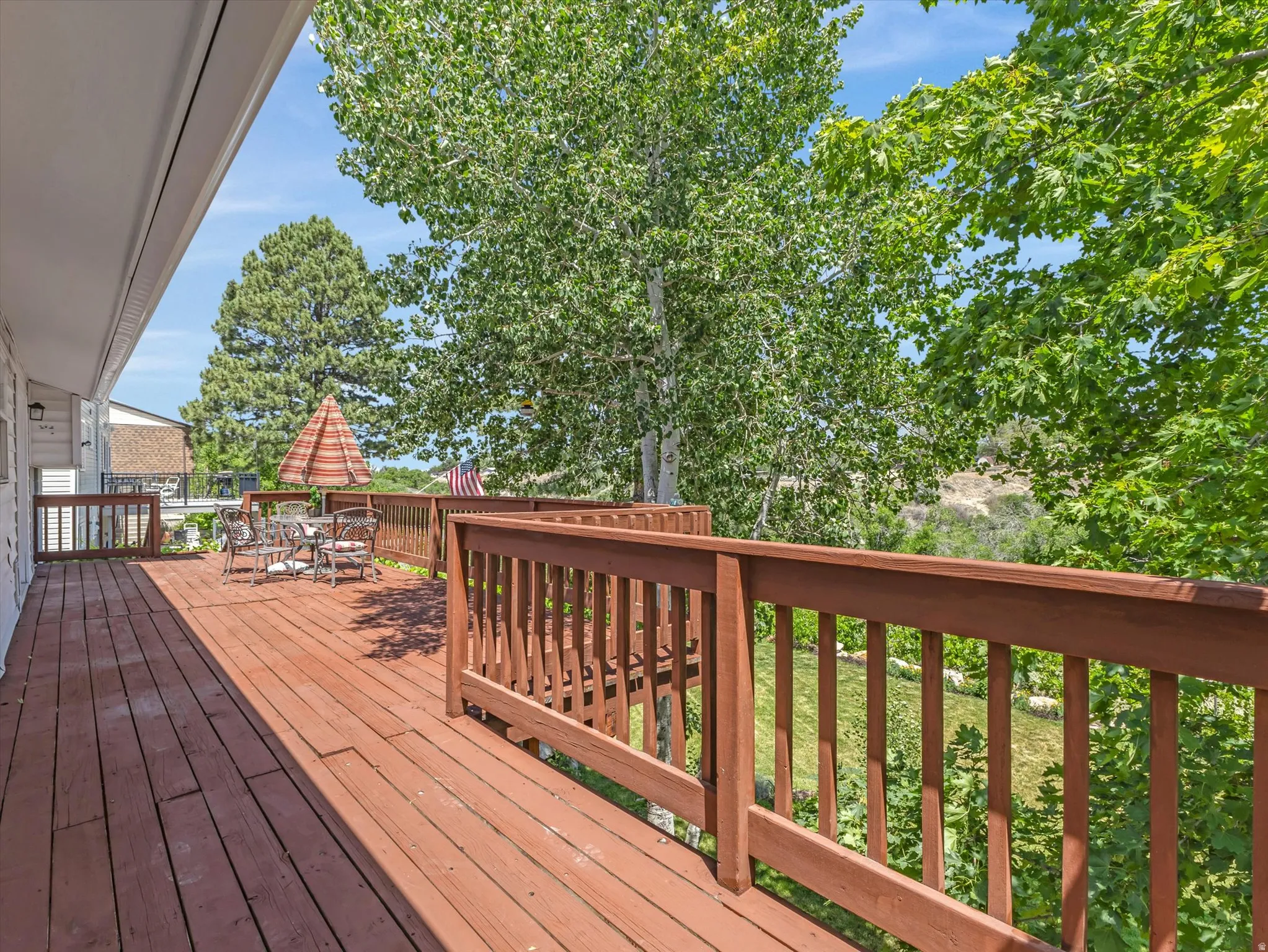 Spacious wood-finish deck with ample room for outdoor furnishings