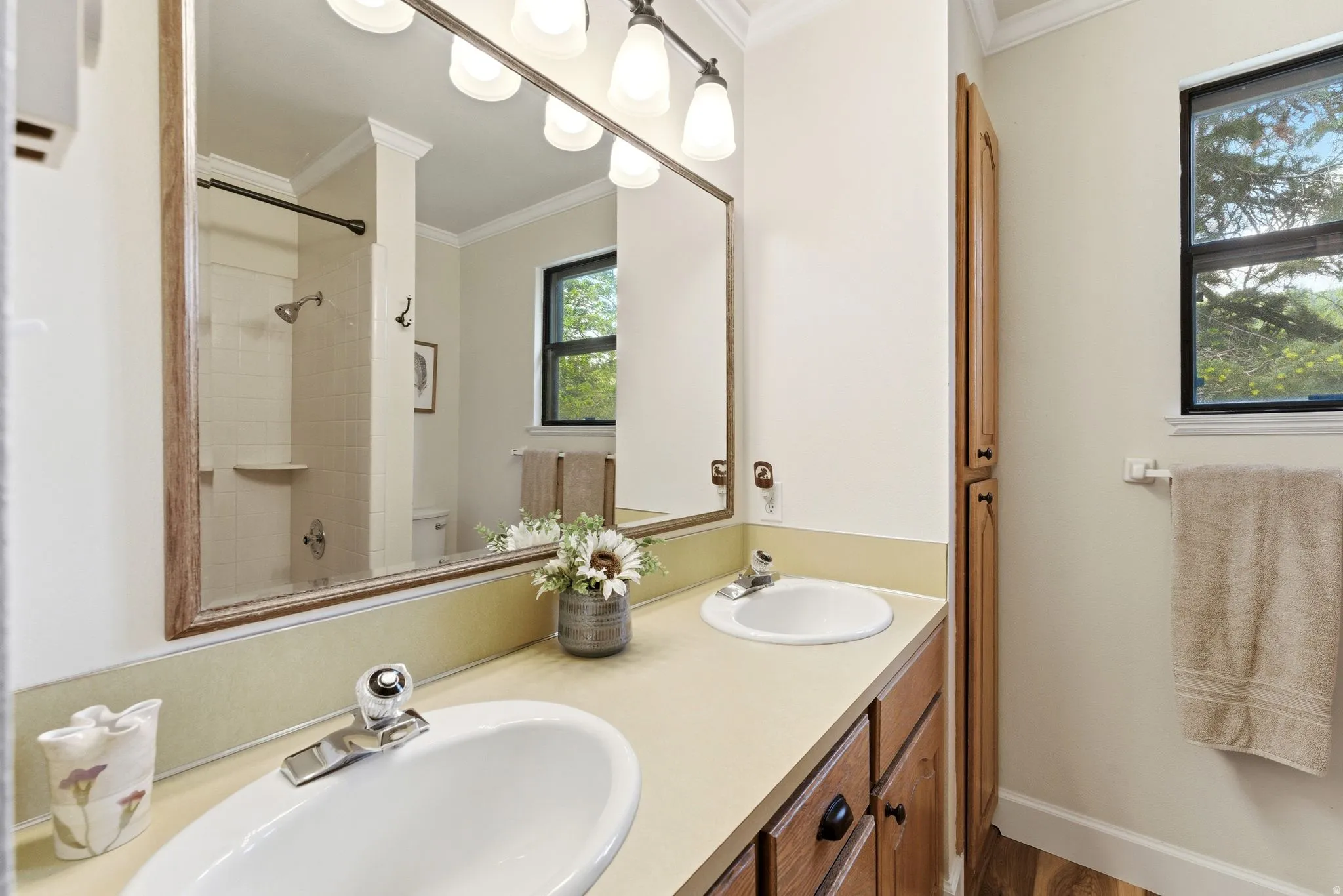 Dual vanity with integrated sinks and chrome fixtures
