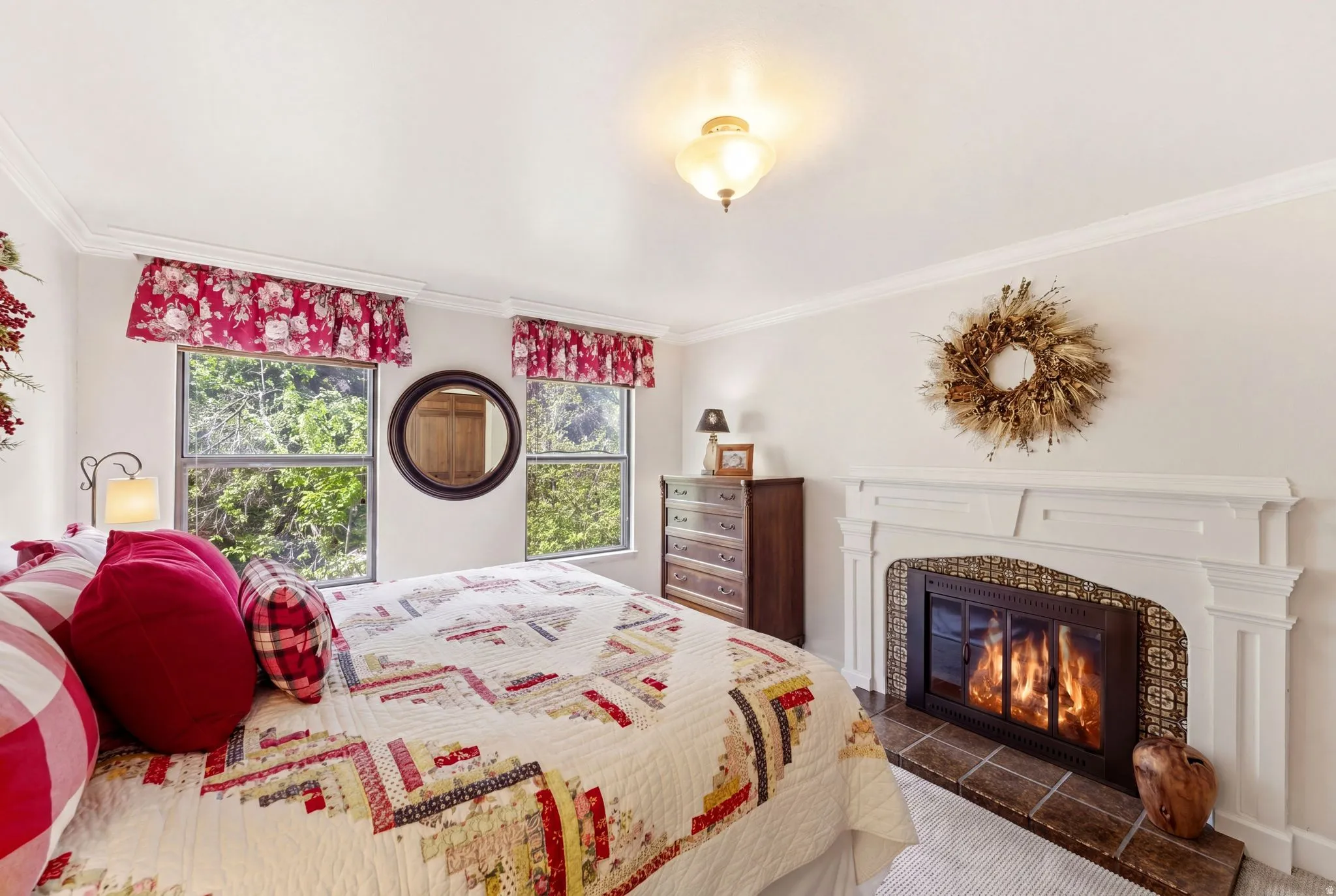 Fireplace with a white mantel and tile surround
