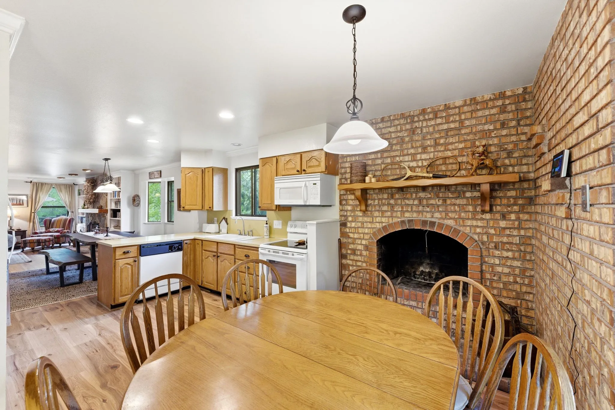 Brick fireplace with a wood mantel