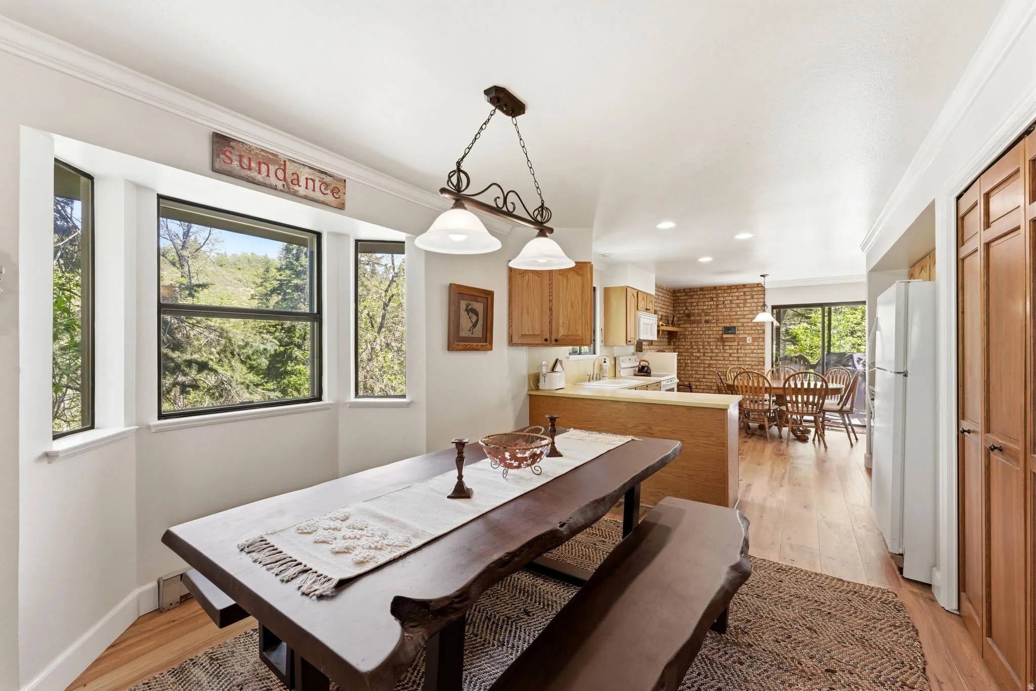 Bay window dining area with wood-finish flooring