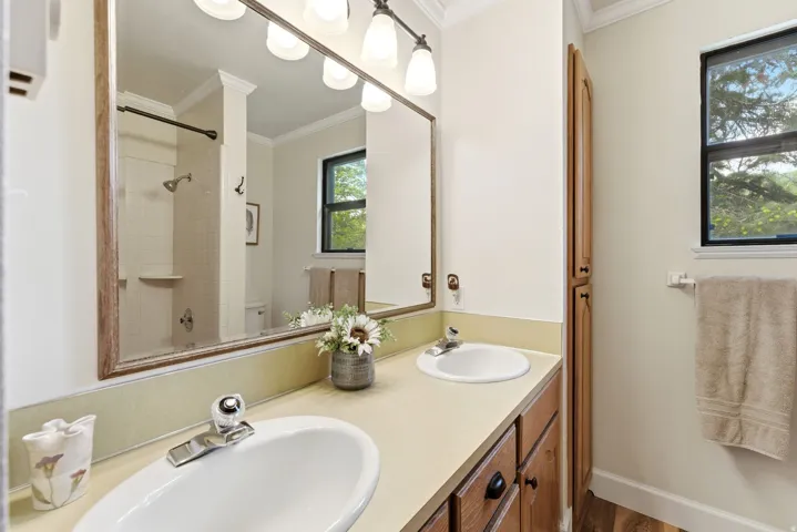 Dual vanity with integrated sinks and chrome fixtures