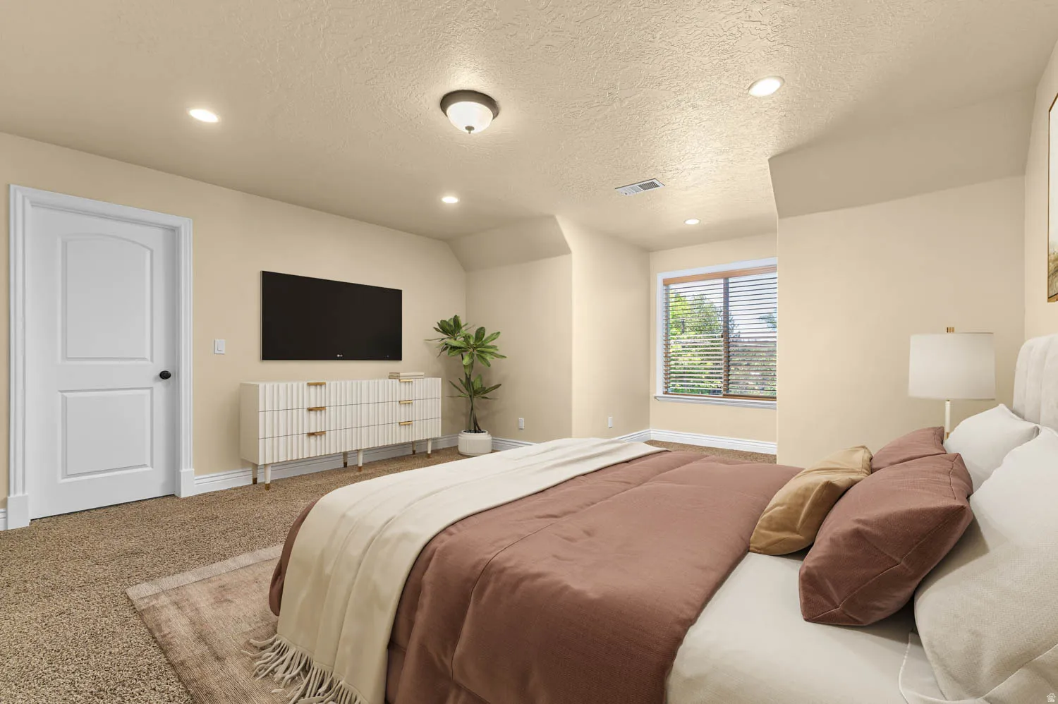 Carpeted bedroom featuring recessed lighting, a window with horizontal blinds, and a paneled white door