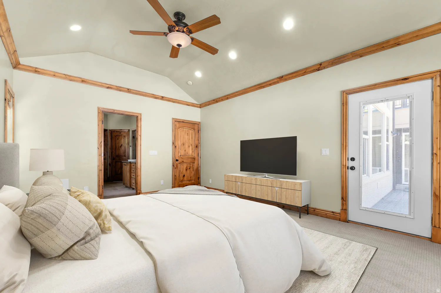 Master bedroom. .Vaulted ceiling featuring a wood-finish ceiling fan and recessed lighting