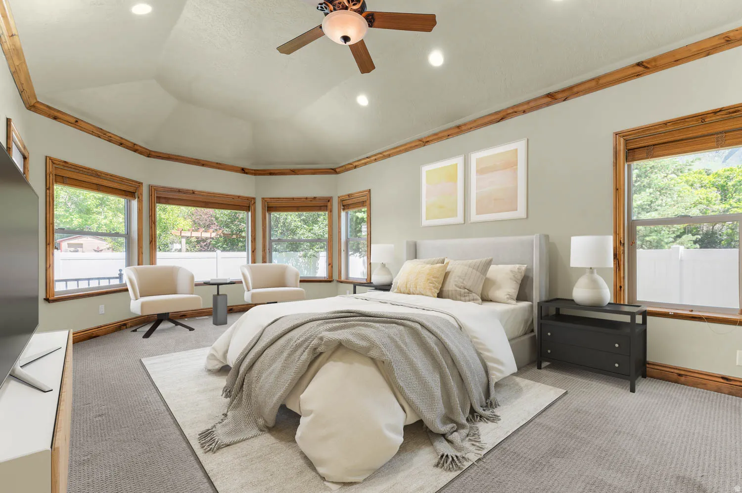 Master bedroom. Bay window with wood-trim framing and a trey ceiling featuring recessed lighting and a ceiling fan